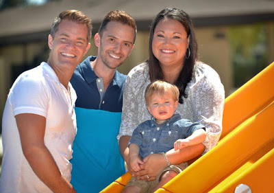 Photo: Dylan Cronrod, 13 months, with his surrogate mother, Andrea Muehlhause, and his two dads, Allen Artclif-Cronrod and Robbie Cronrod.